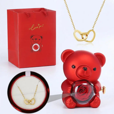 Ewiger Rosen-Teddybär Geschenkset by Amorlune featuring a plush teddy bear with preserved roses in a decorative arrangement.