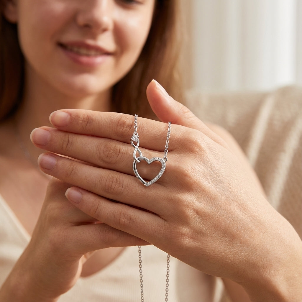 Infinity heart necklace made of 925 sterling silver by Amorlune, showcasing a delicate and elegant design.